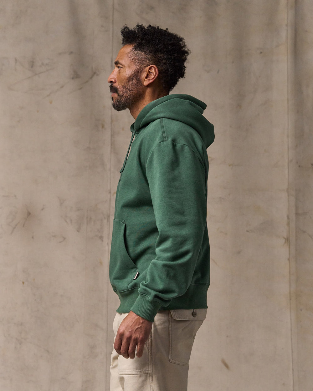 image of a model wearing Filson's Northwest Hoodie - Granite Green