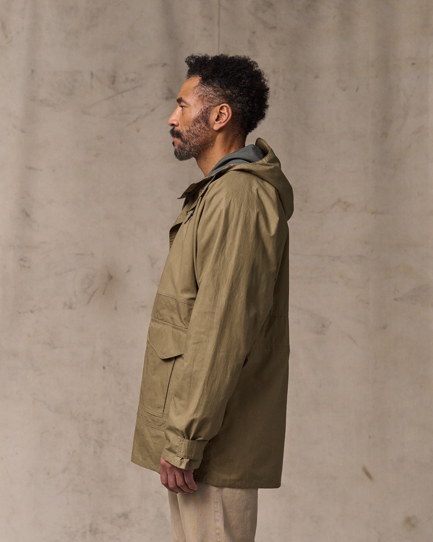 image of a model wearing Filson's Dry Wax Omak Coat - Dark Beige