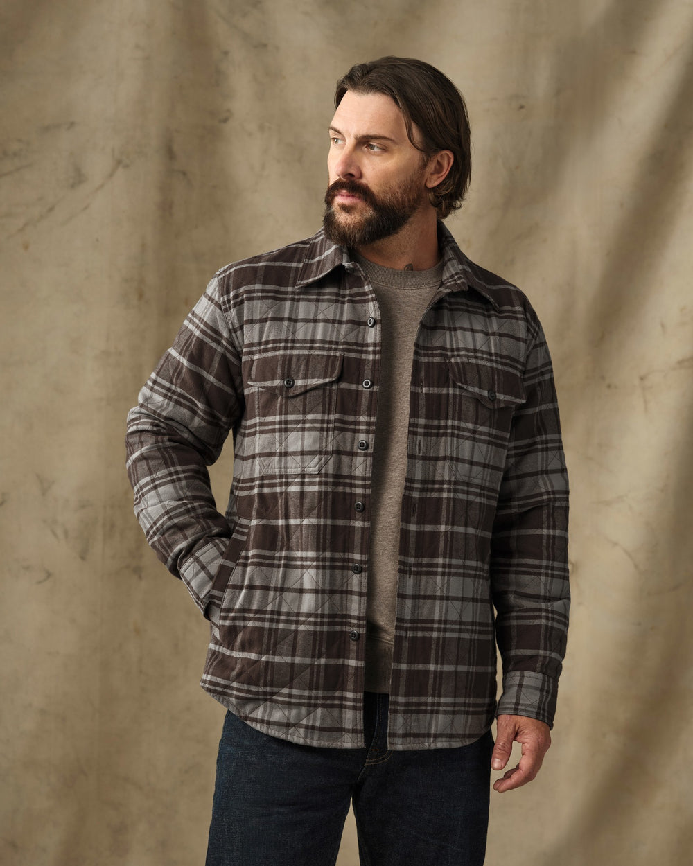 image of a model wearing Filson's Insulated Flannel Jac-Shirt - Brown / Gray Plaid