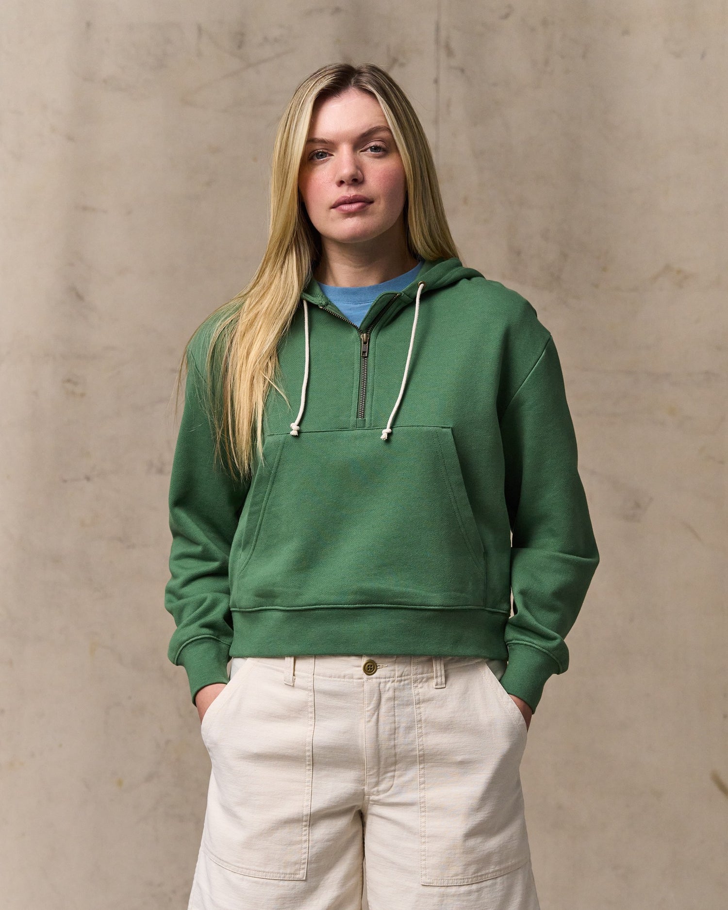 image of a model wearing Filson's Women's French Terry Half-zip Hoodie - Light Forest|Model is 5'10" wearing a size medium|Model is 5'10" wearing a size medium