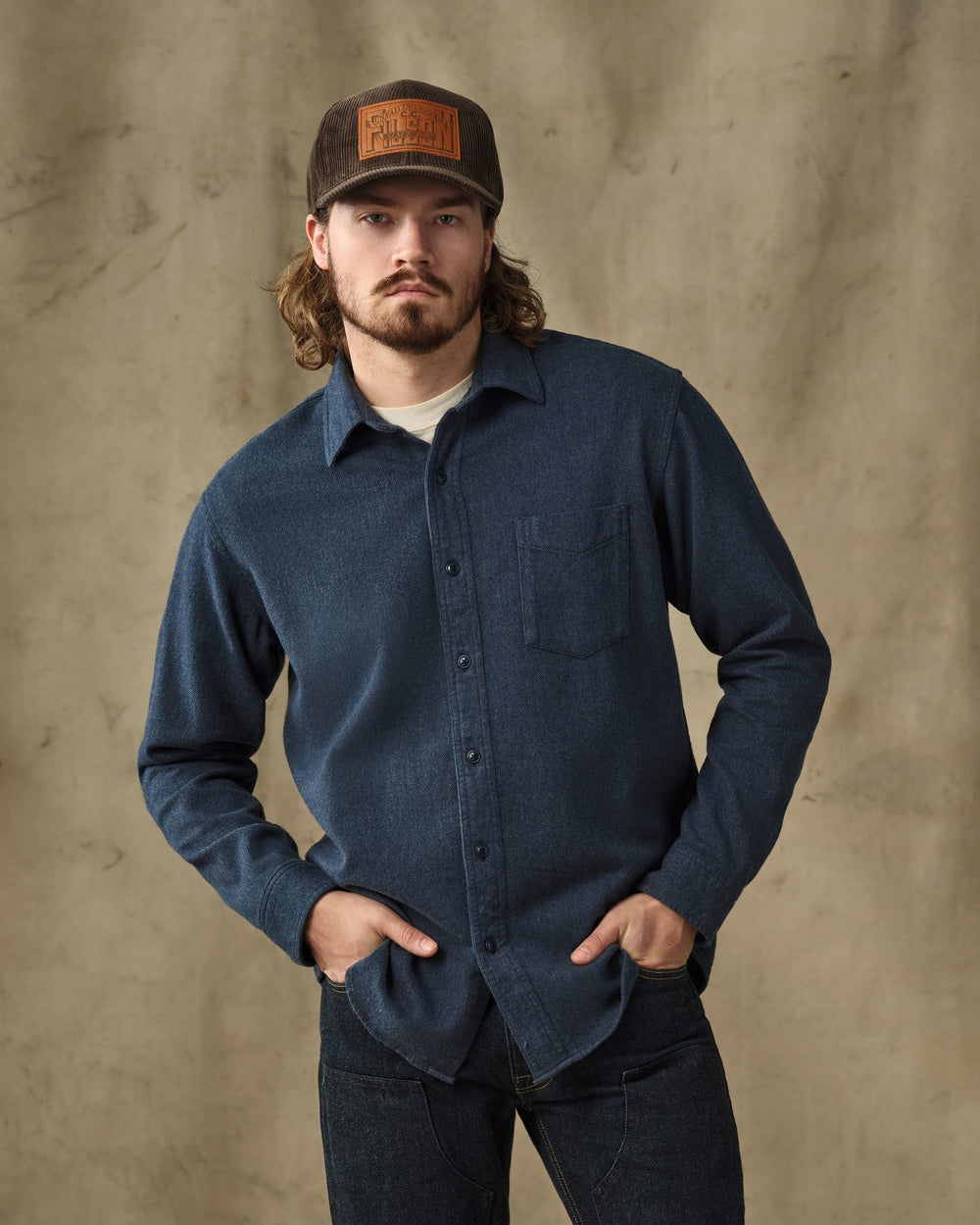 image of a model wearing Filson's Rustic Flannel Shirt - Blue Heather