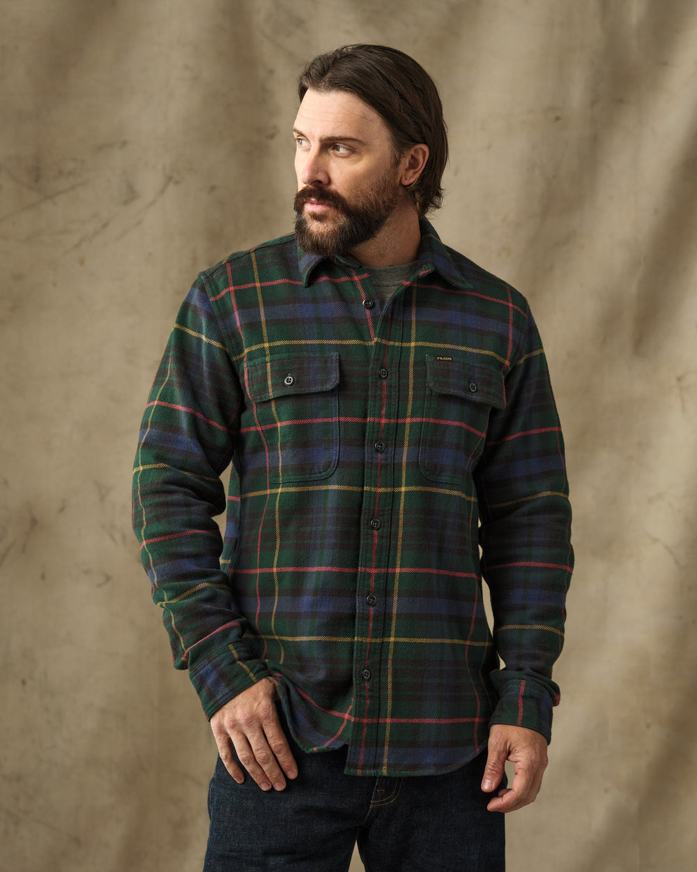 image of a model wearing Filson's Vintage Flannel Work Shirt - Green / Navy Plaid
