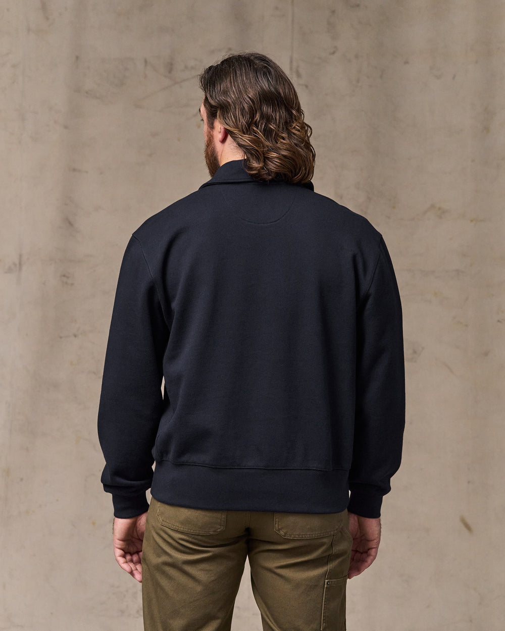image of a model wearing Filson's 14-oz. Heritage Fleece Quarter Zip - Dark Indigo