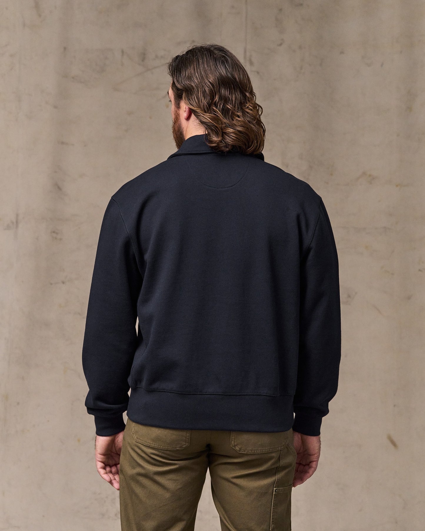 image of a model wearing Filson's 14-oz. Heritage Fleece Quarter Zip - Dark Indigo