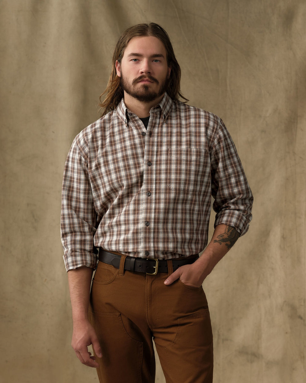 image of a model wearing Filson's Chambray Button-Down Shirt - Cascade Plaid