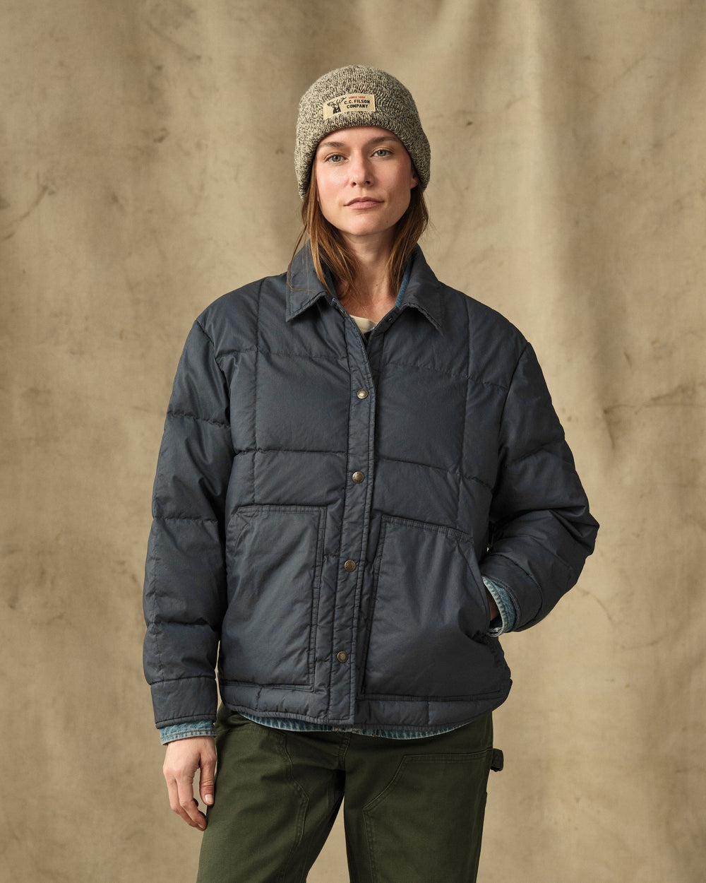 image of a model wearing Filson's Women's Heritage Cotton Down Jacket - Bluefin