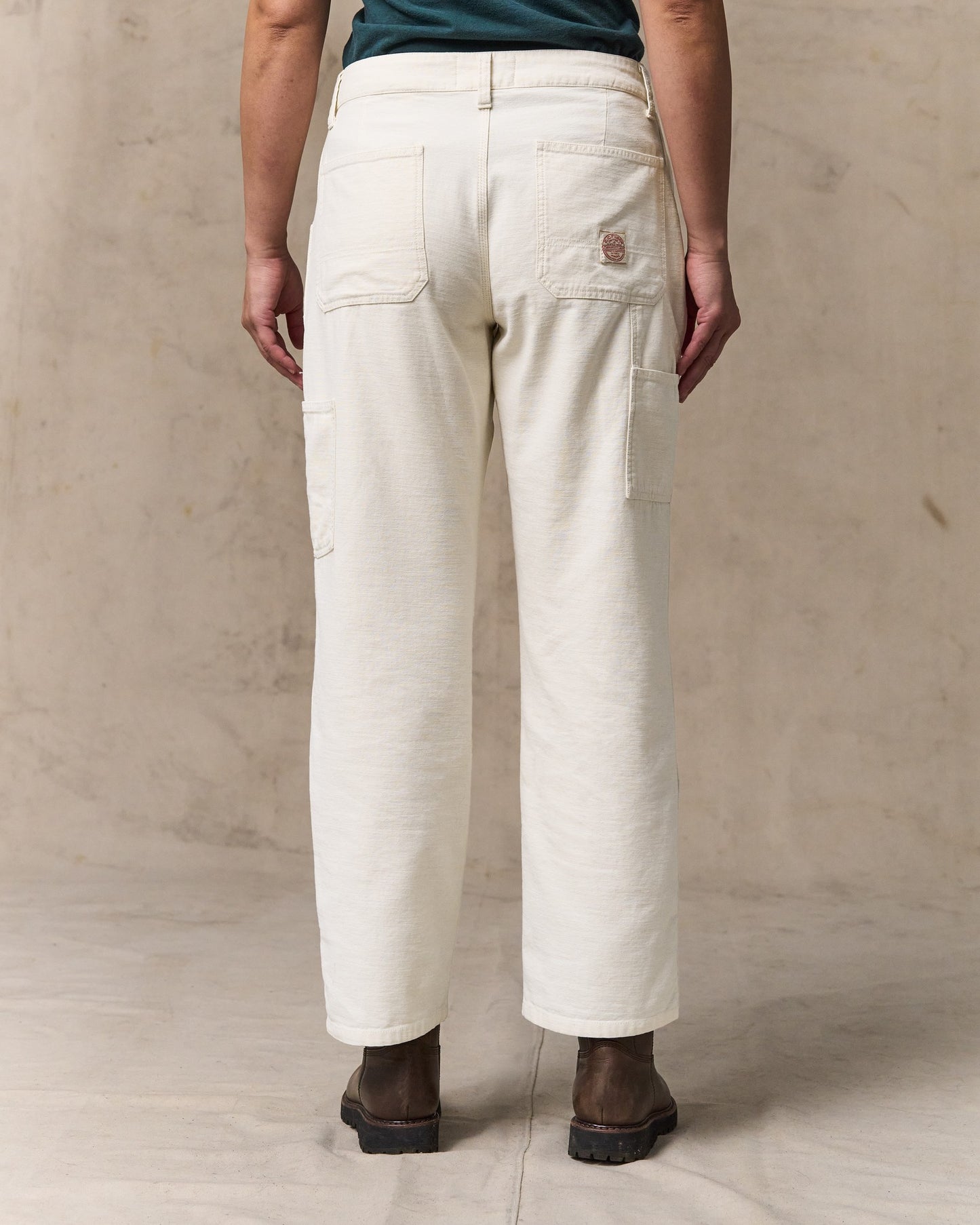 image of a model wearing Filson's Women's Reverse Sateen Double Front Pants - Natural Seed