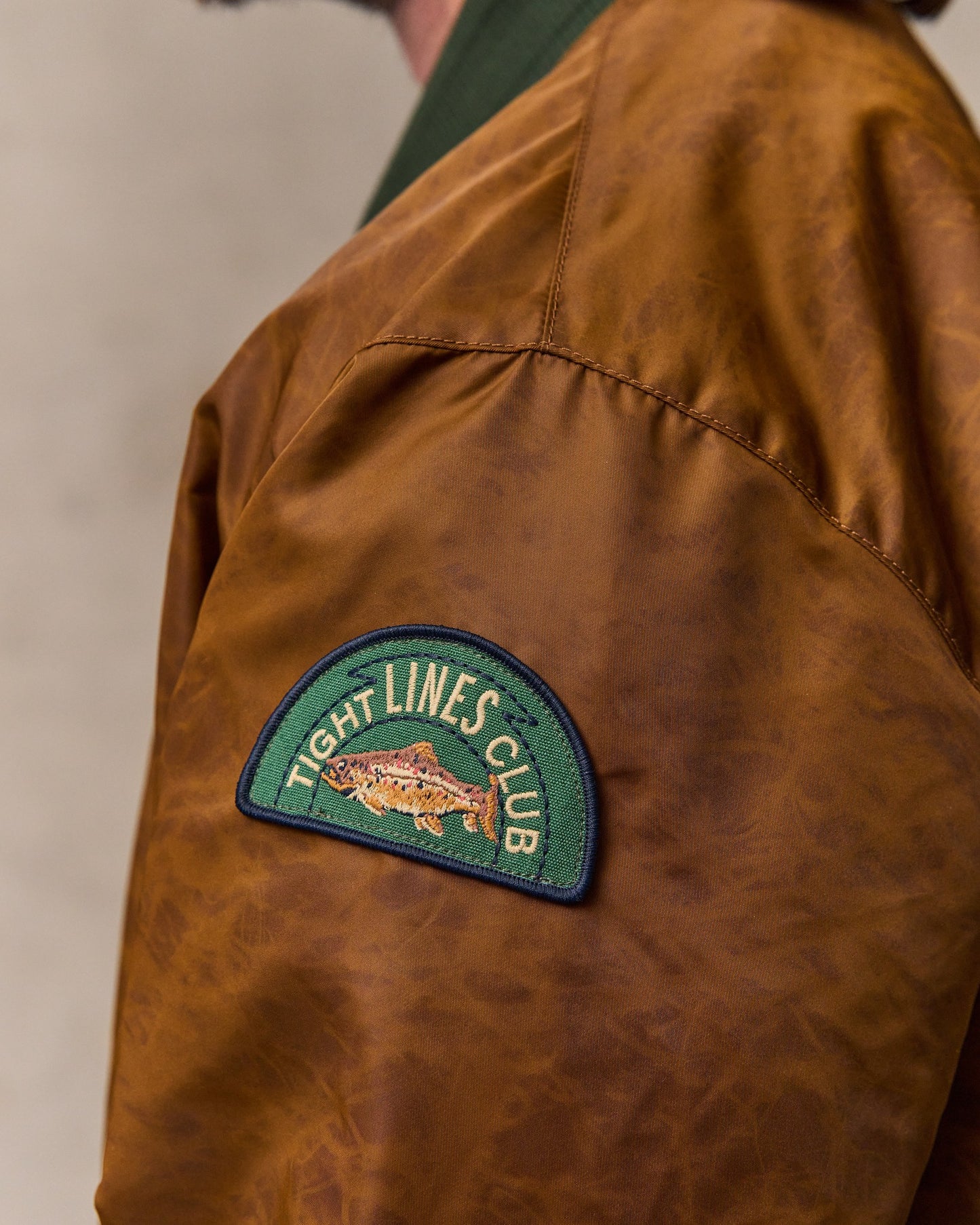 image of a model wearing Filson's Embroidered Montlake Jacket - Whiskey