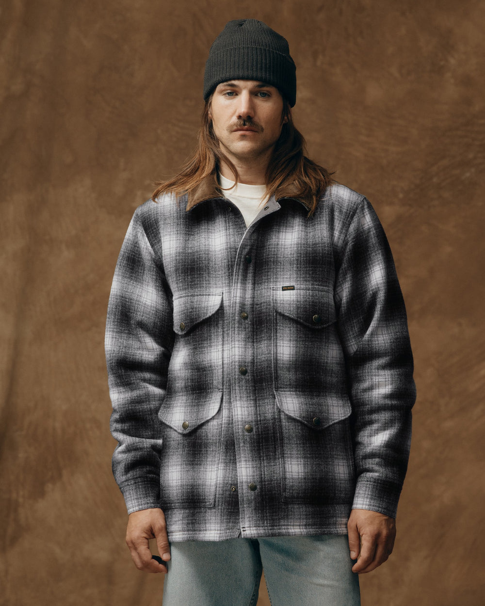 image of a model wearing Filson's Spokane Insulated Cruiser Jacket - Charcoal Ombre