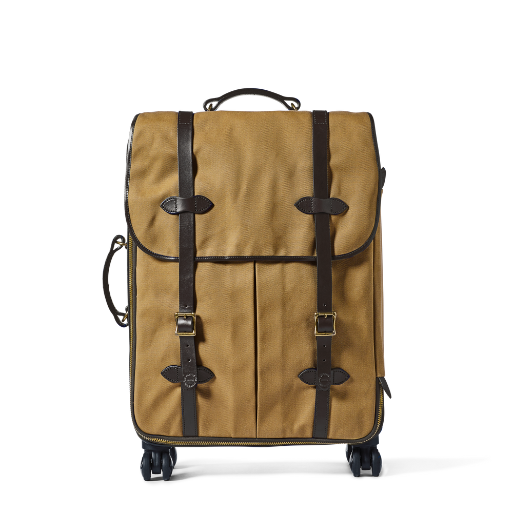 Front-facing image of the Filson Rugged Twill Rolling 4-wheel Check-in Bag - Tan
