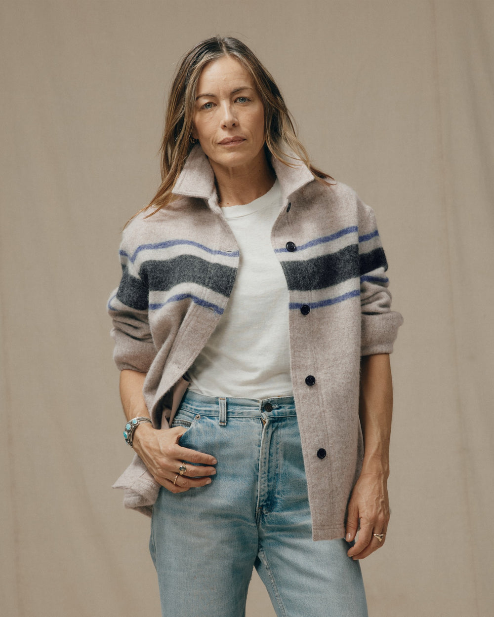 image of a model wearing Filson's Women's Wool Overshirt - Gray / Black Blanket Stripe