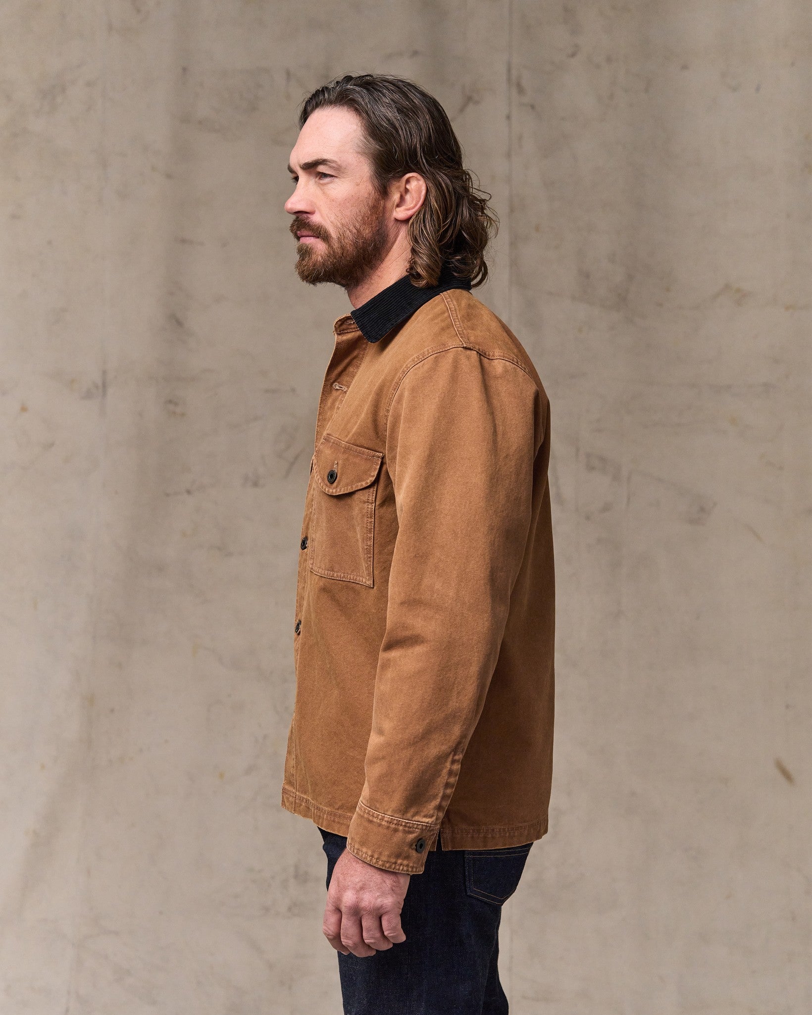 image of a model wearing Filson's Rustic Canvas Jac-shirt - Whiskey