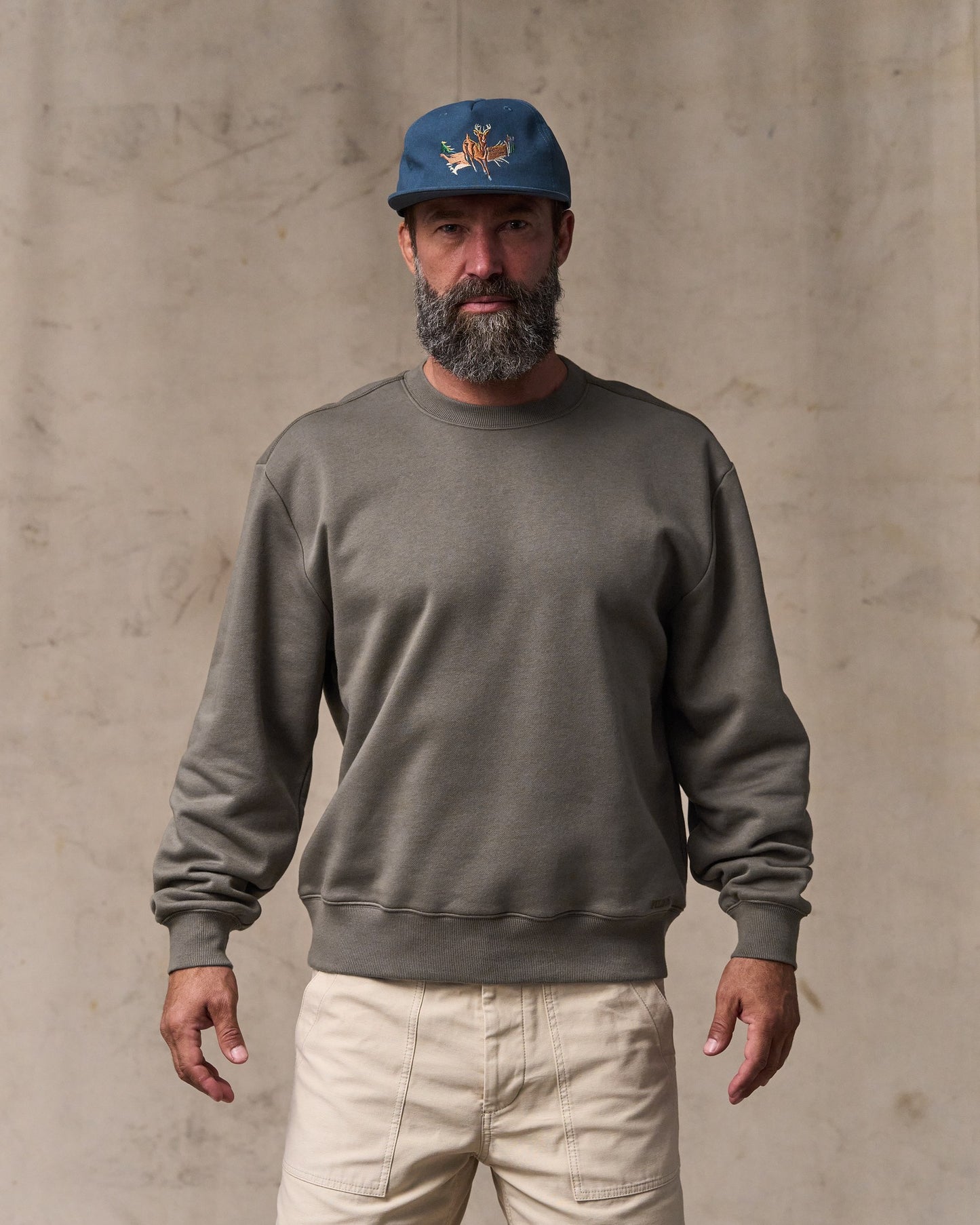 image of a model wearing Filson's Northwest Crewneck Sweatshirt - Hawk Brown|Model is 6'1" wearing a size medium