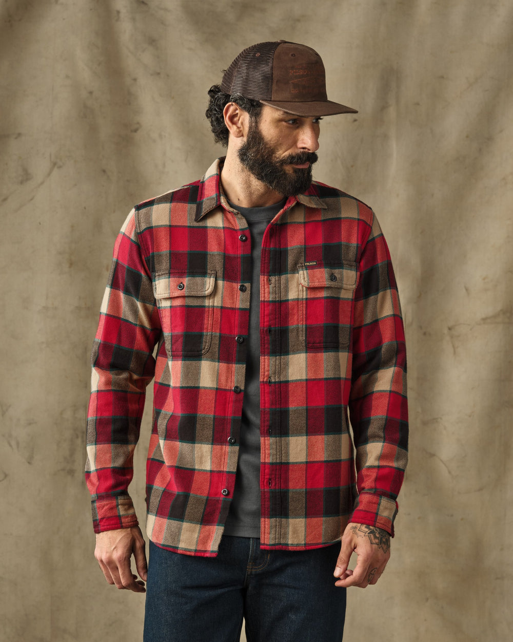 image of a model wearing Filson's Vintage Flannel Work Shirt - Red / Cream Plaid