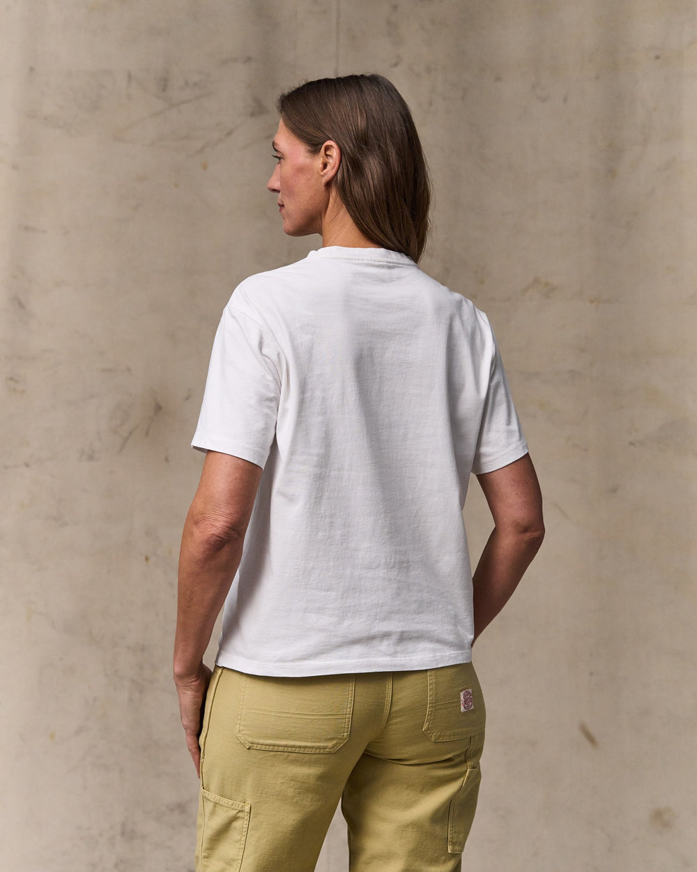 image of a model wearing Filson's Women's Short Sleeve Pocket Tee - Bright White