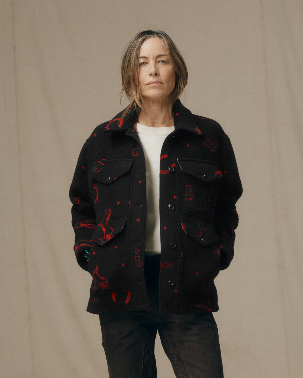 image of a model wearing Filson's Women's Jacquard Wool Cruiser Jacket - Black / Red Western