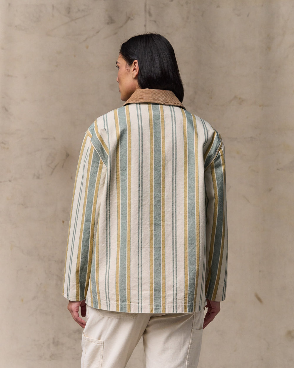 image of a model wearing Filson's Women's Canvas Barn Coat - Natural / Yellow