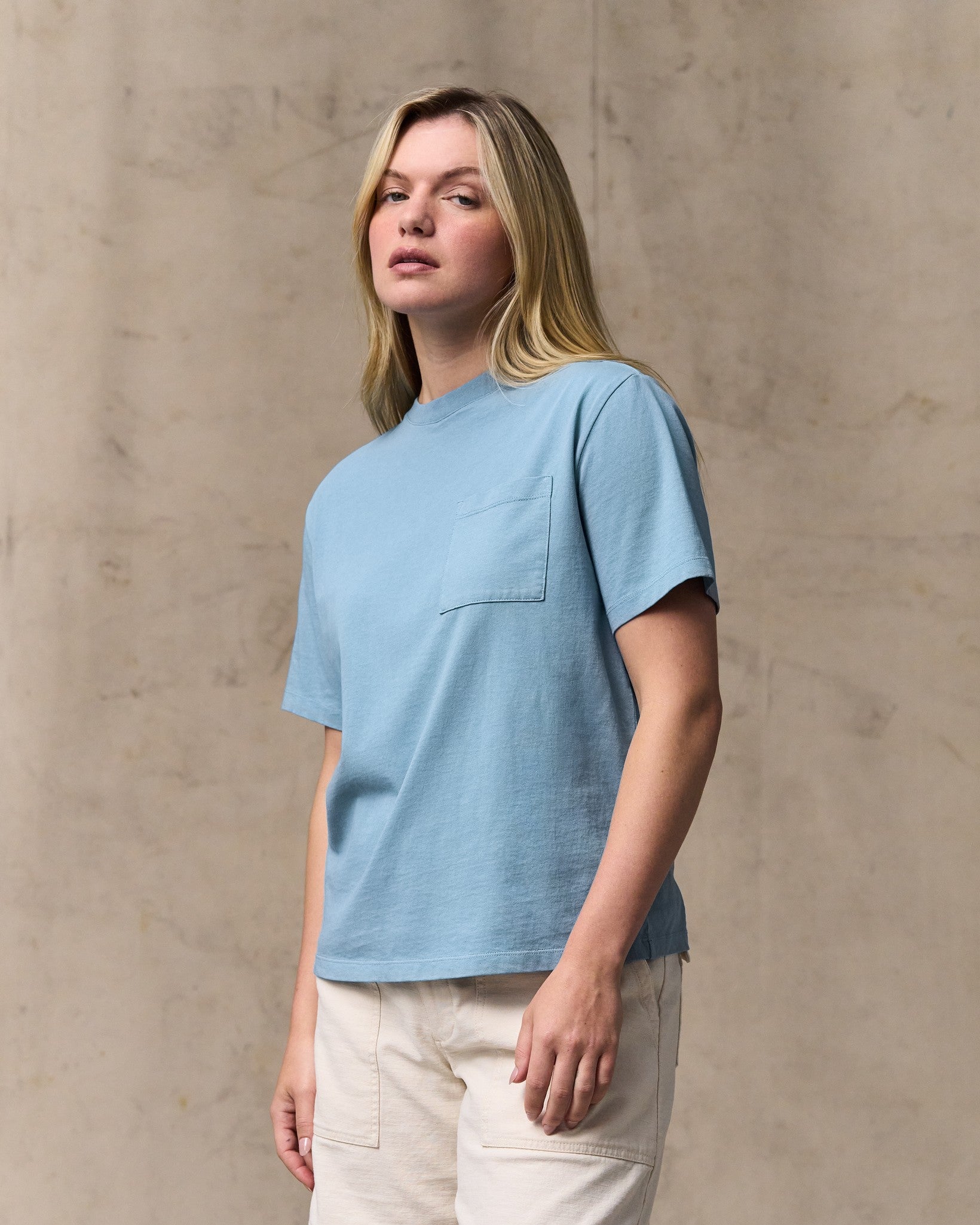 image of a model wearing Filson's Women's Short Sleeve Pocket Tee - Light Blue