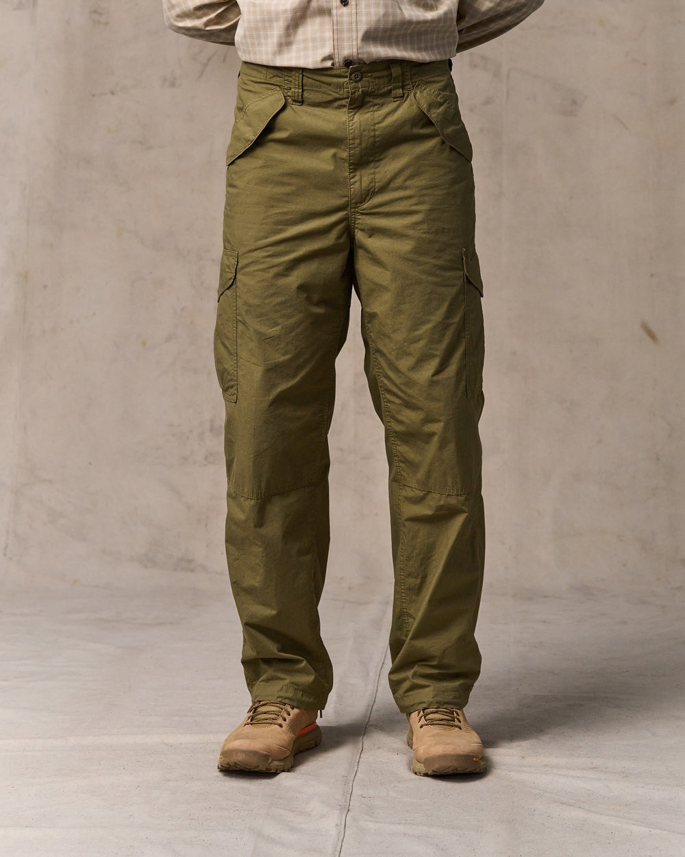 image of a model wearing Filson's Tropical Poplin Cargo Pants - Military Olive