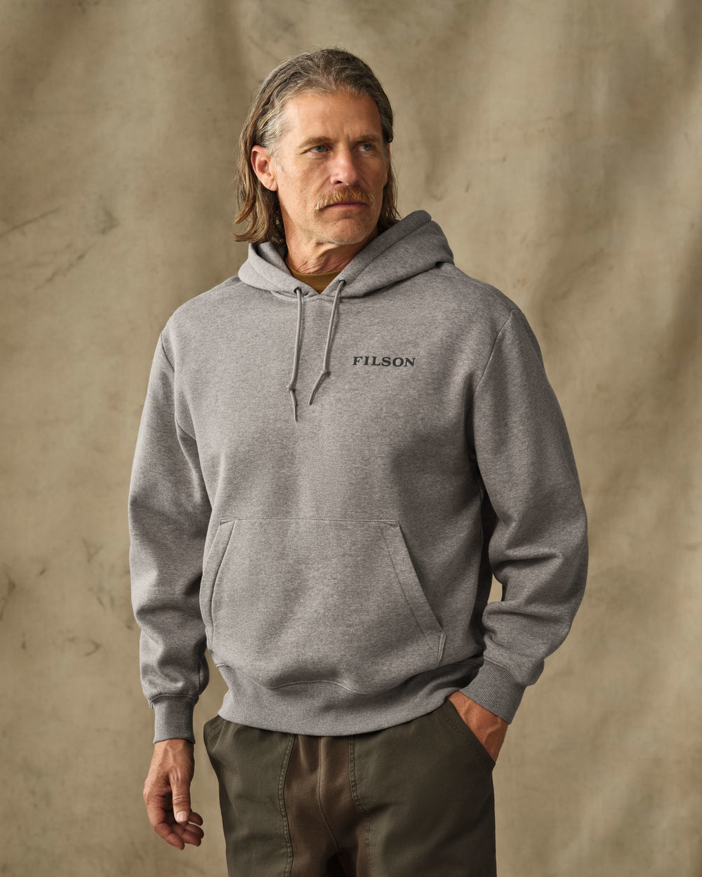 image of a model wearing Filson's Scenic Graphic Hoodie - Vintage Heather Gray