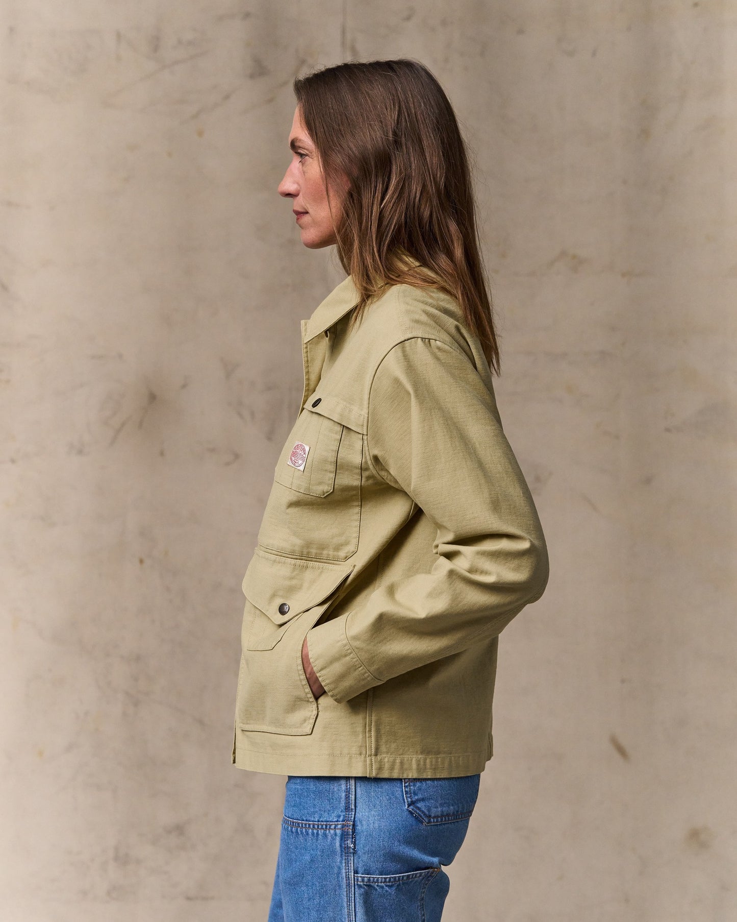 image of a model wearing Filson's Women's Reverse Sateen Cruiser Jacket - Antique Khaki
