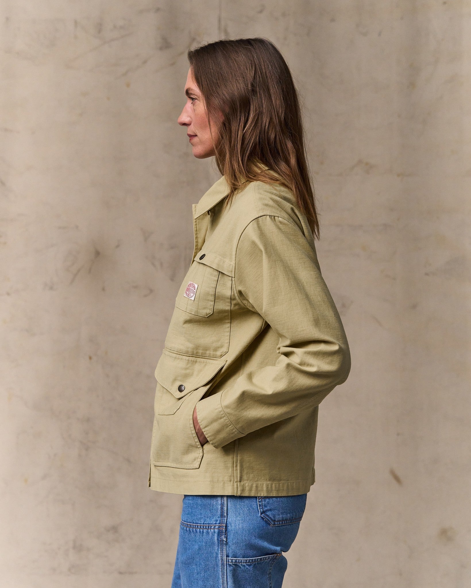 image of a model wearing Filson's Women's Reverse Sateen Cruiser Jacket - Antique Khaki