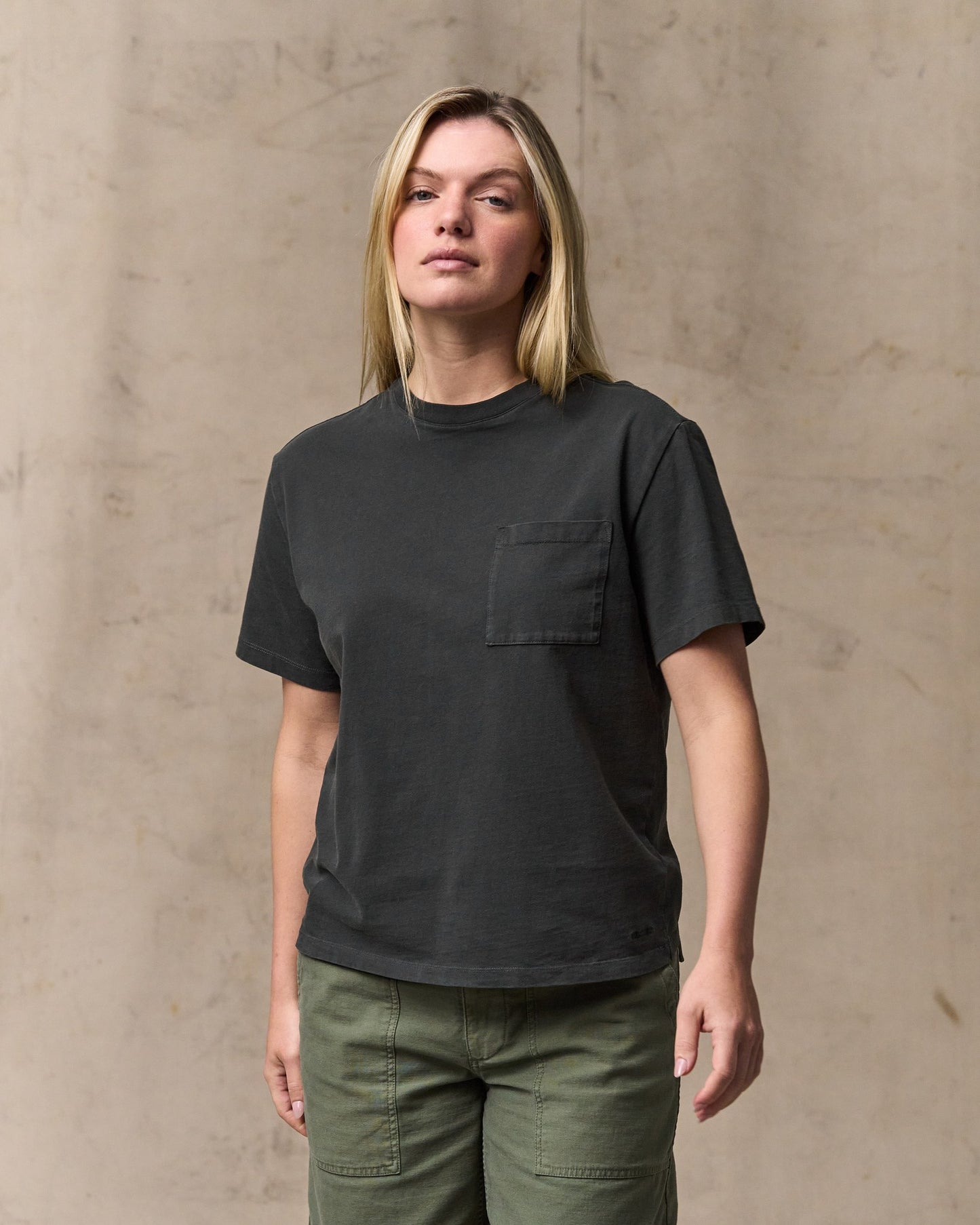 image of a model wearing Filson's Women's Short Sleeve Pocket Tee - Faded Black|Model is 5'10" wearing a size medium|Model is 5'10" wearing a size medium
