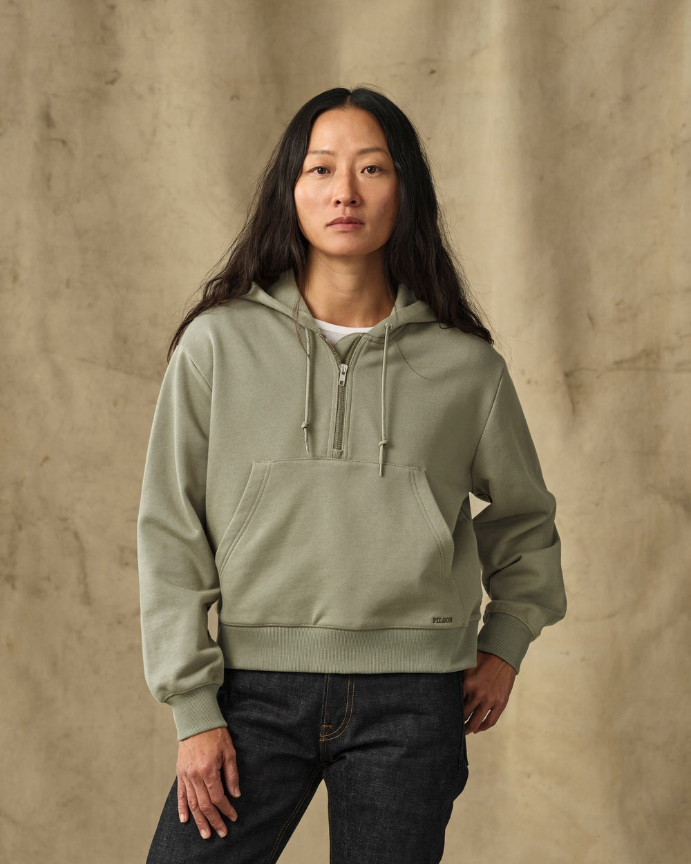 image of a model wearing Filson's Women's French Terry Half-Zip Hoodie - Olive Branch