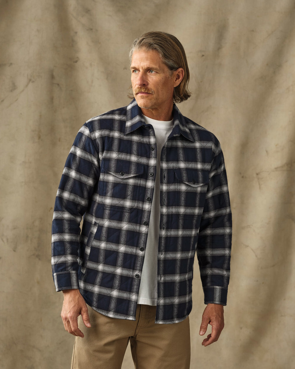 image of a model wearing Filson's Insulated Flannel Jac-Shirt - Navy / Cream Plaid