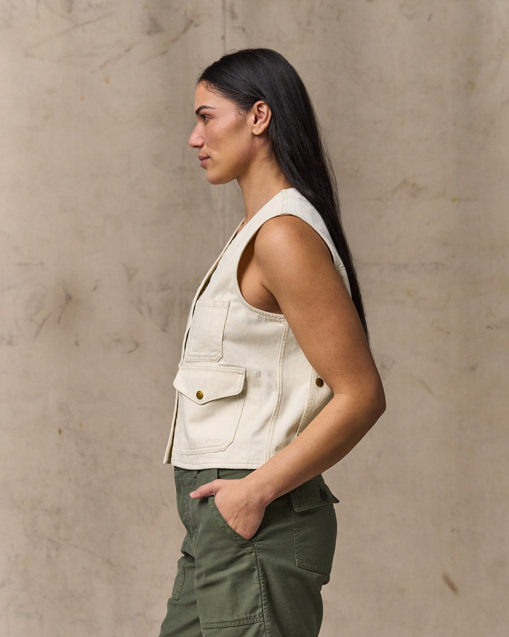 image of a model wearing Filson's Women's Archive Cruiser Vest - Natural Seed