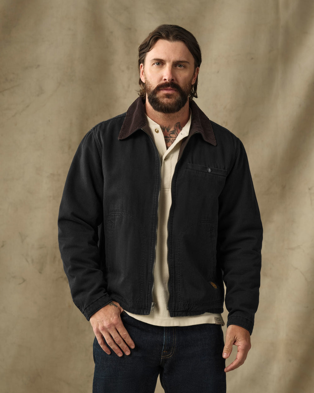 image of a model wearing Filson's Denim Tacoma Jacket - Rinsed Black