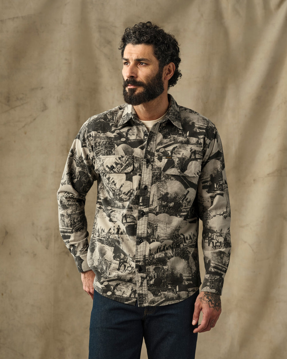 image of a model wearing Filson's Field Flannel Shirt - Vintage Khaki Print