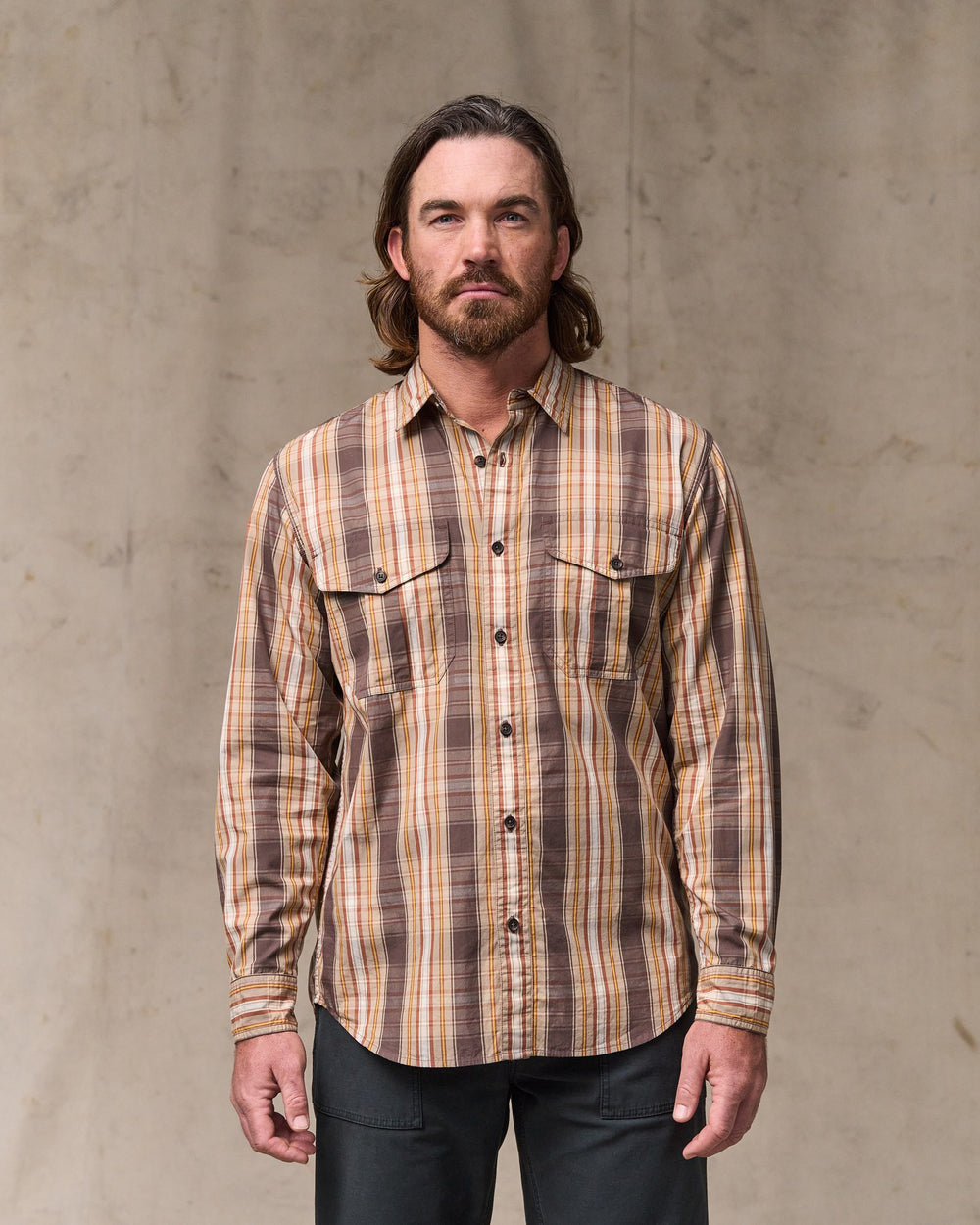 image of a model wearing Filson's Filson's Washed Feather Cloth Shirt - Brown Multi Plaid