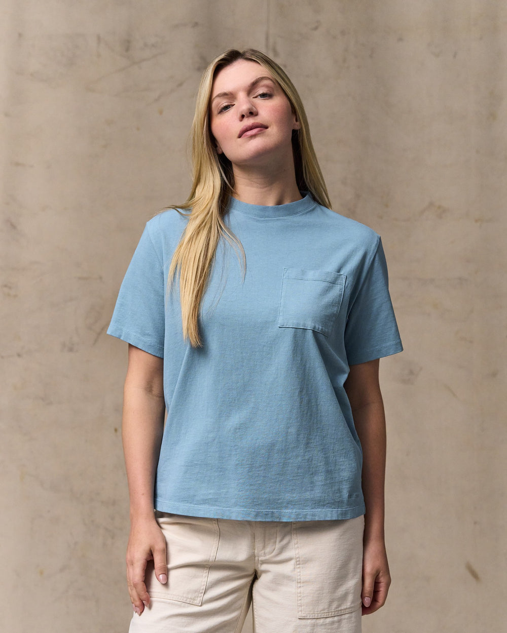 image of a model wearing Filson's Women's Short Sleeve Pocket Tee - Light Blue