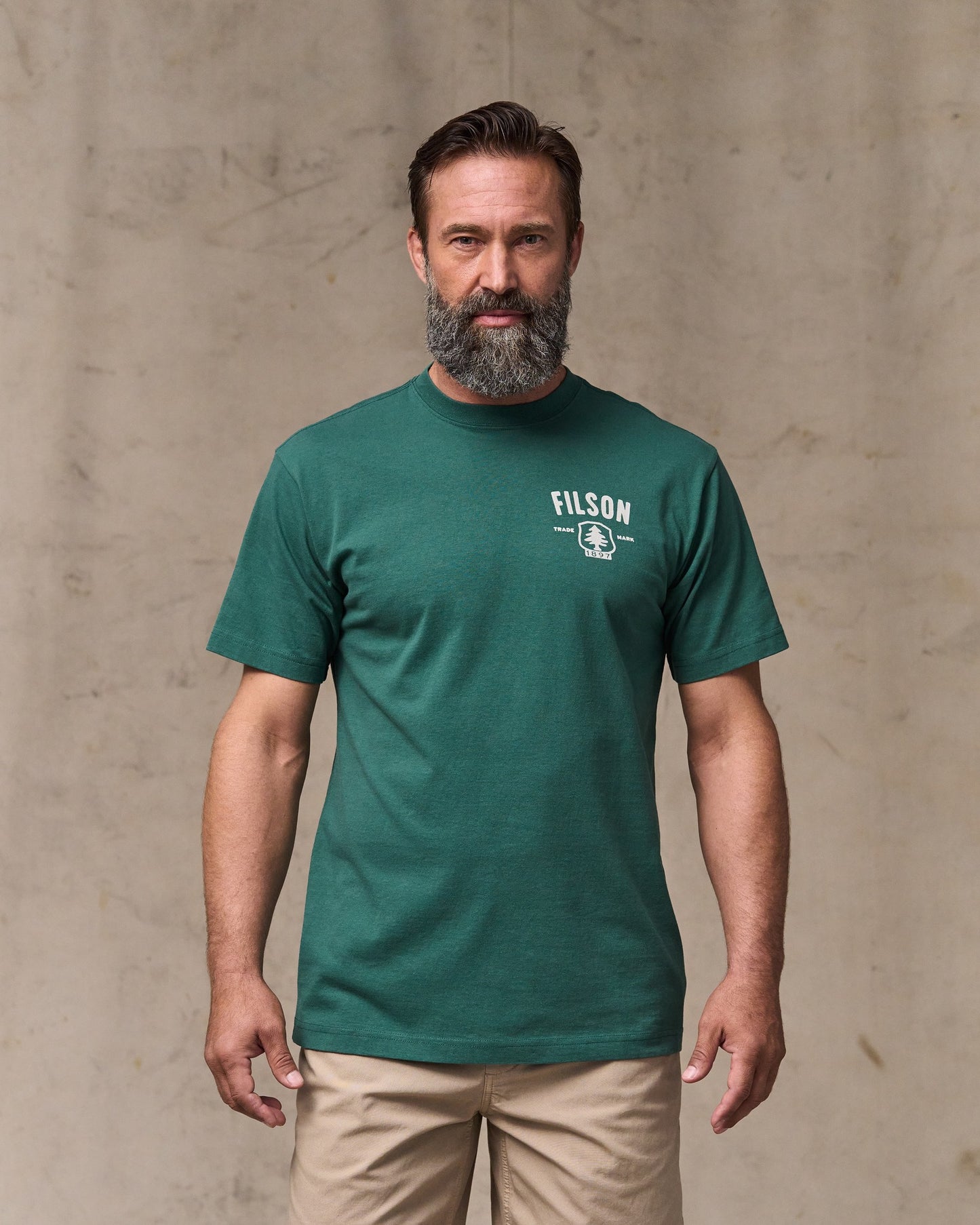 image of a model wearing Filson's Forestry Graphic T-shirt - Mallard Green|Model is 6'1" wearing a size medium