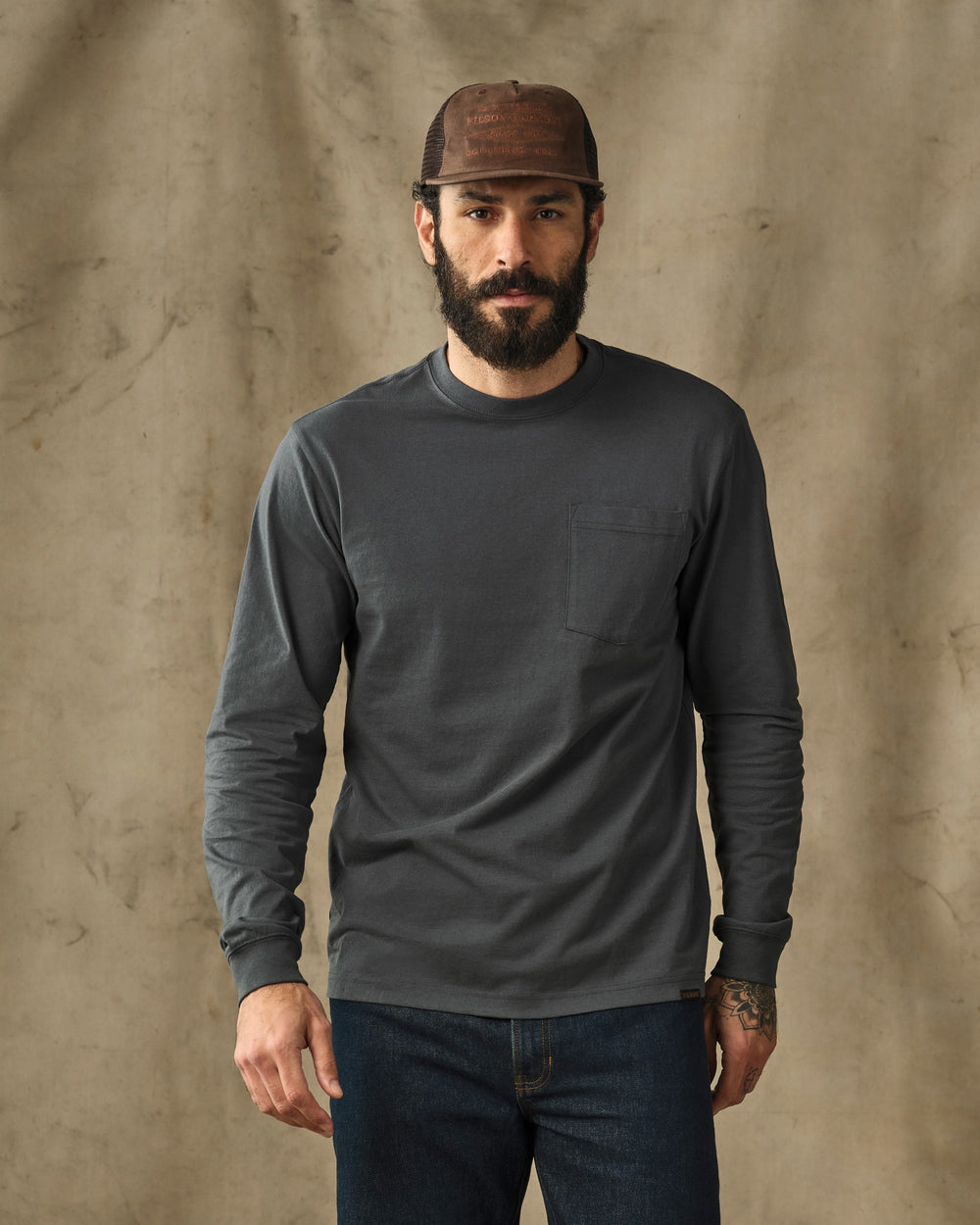 image of a model wearing Filson's Long Sleeve Outfitter Pocket T-Shirt - Dark Slate