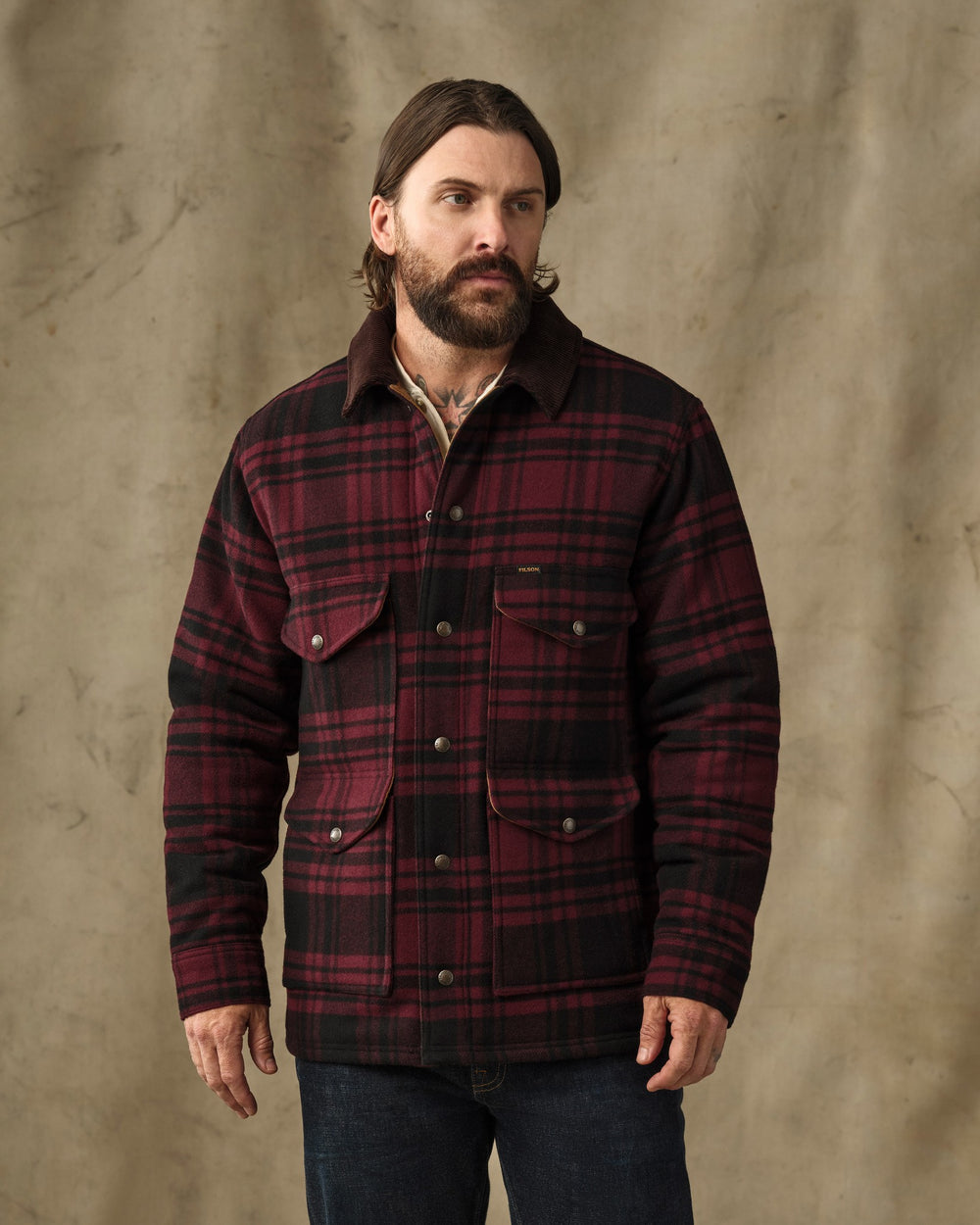 image of a model wearing Filson's Spokane Insulated Cruiser Jacket - Port / Black Plaid