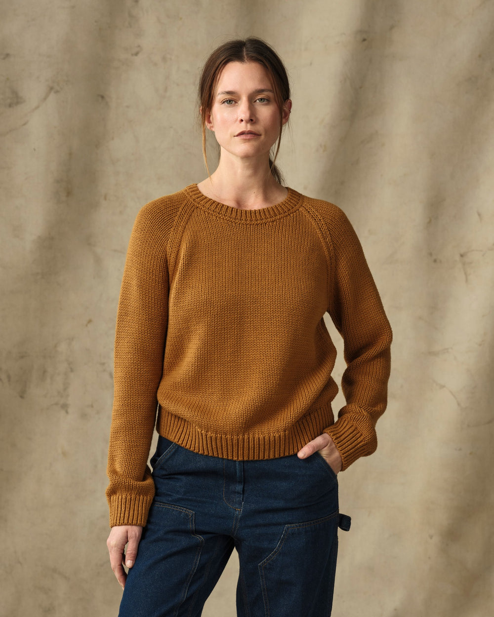 image of a model wearing Filson's Women's Cotton Crewneck Sweater - Golden Brown