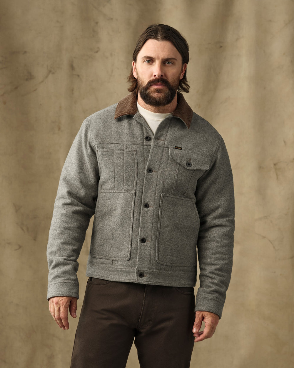 image of a model wearing Filson's Spokane Insulated Short Cruiser - Vintage Heather Gray