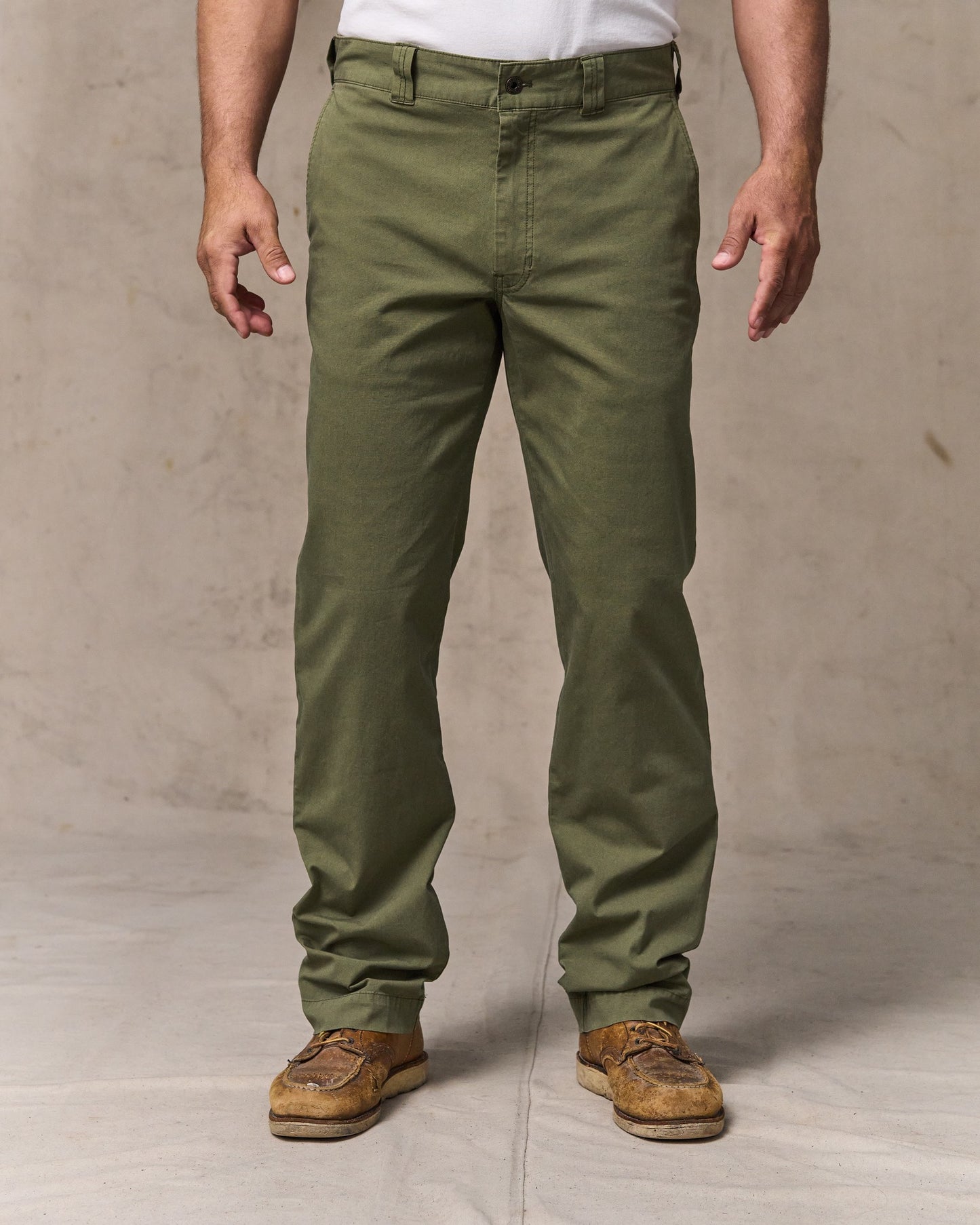 image of a model wearing Filson's Granite Mountain Flat Front Pants - Burnt Olive|Model is 6'1" wearing a size 34x32