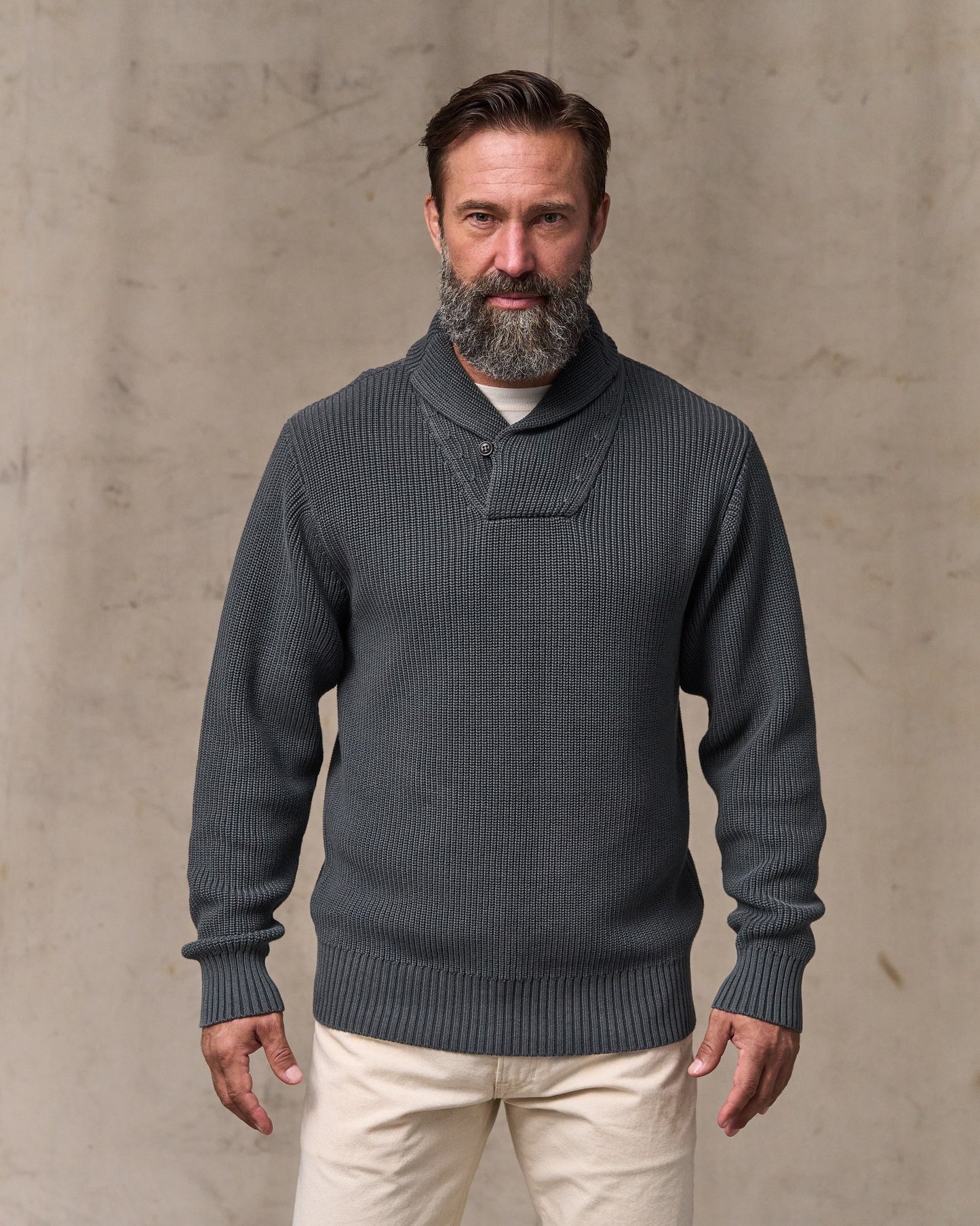 image of a model wearing Filson's Vintage Cotton Shawl Neck Sweater - Charcoal|Model is 6'1" wearing a size medium