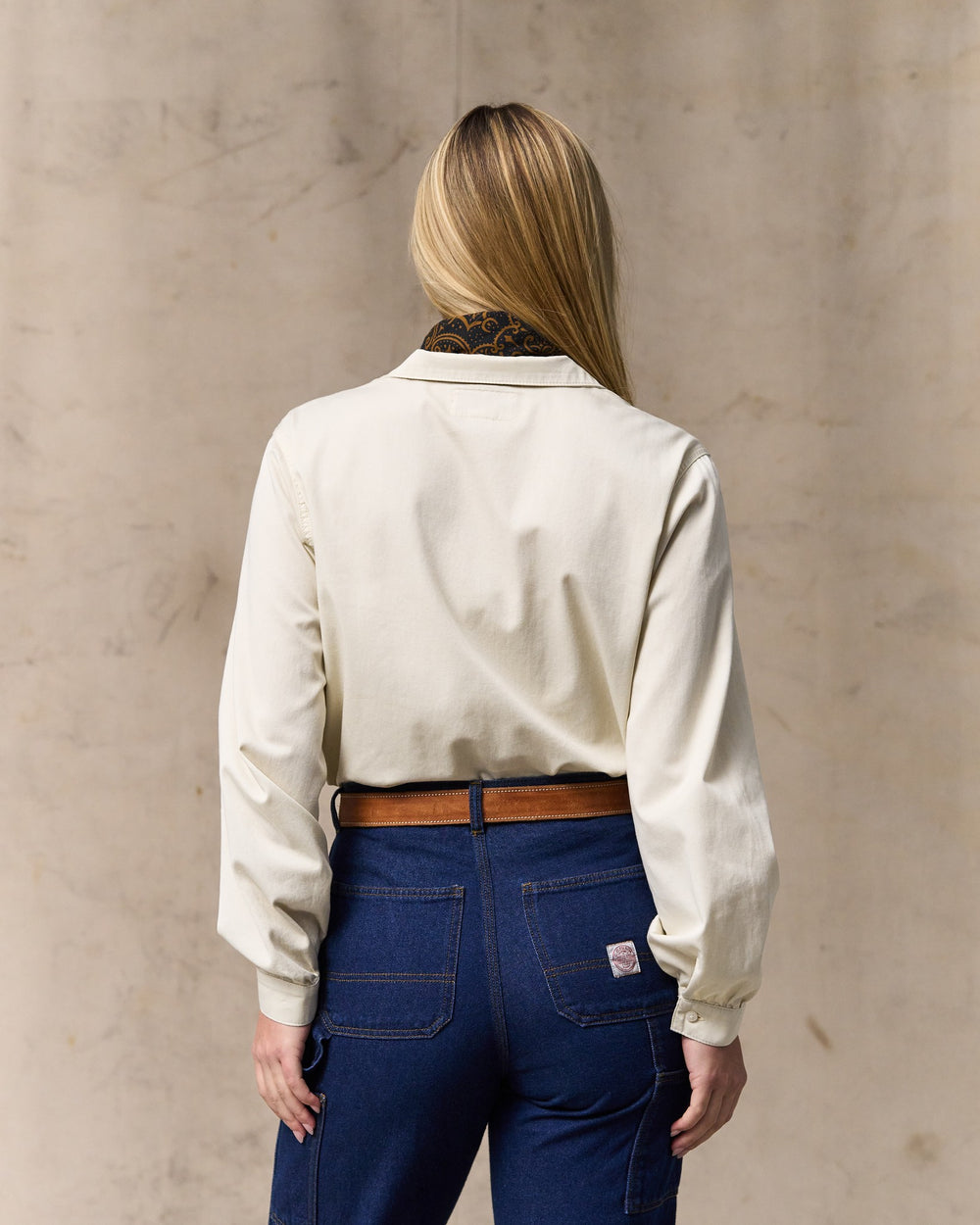 image of a model wearing Filson's Women's Long Sleeve Twill Camp Shirt - Cream