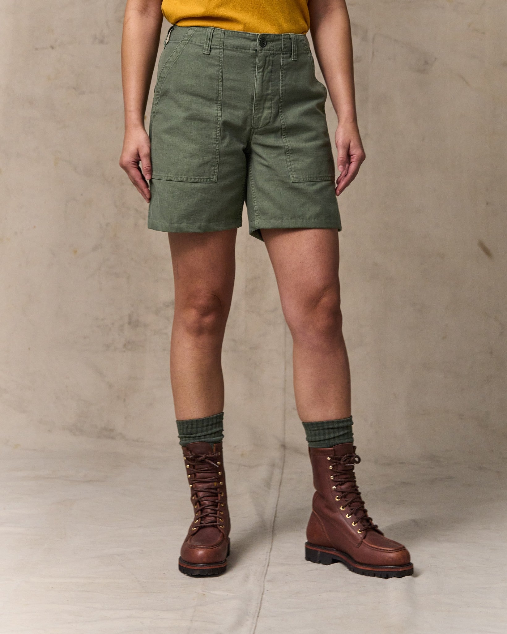 image of a model wearing Filson's Women's Reverse Sateen Supply Shorts - Service Green