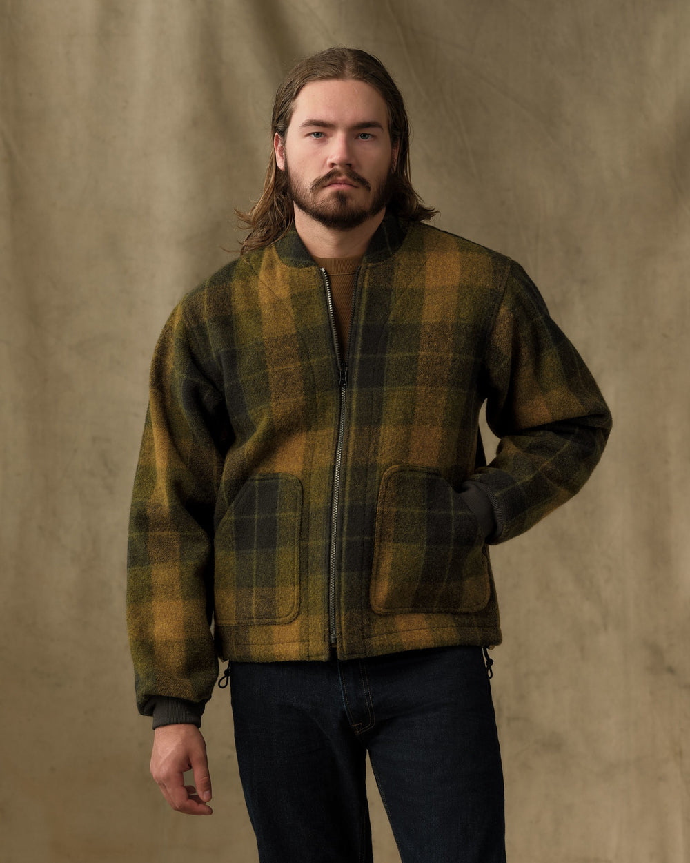 image of a model wearing Filson's Wool Jacket Liner - Loden Heather Plaid