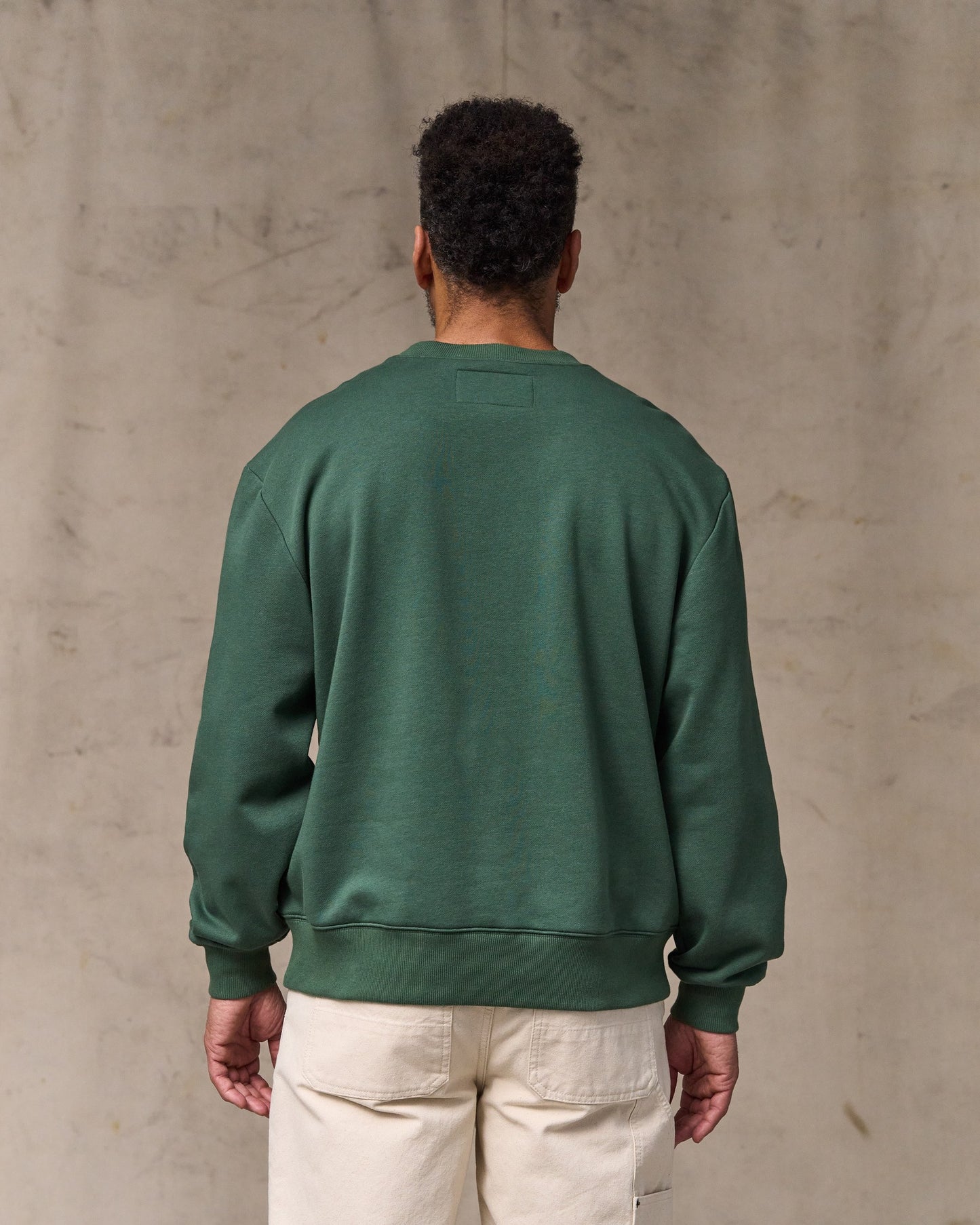 image of a model wearing Filson's Northwest Crewneck Sweatshirt - Granite Green