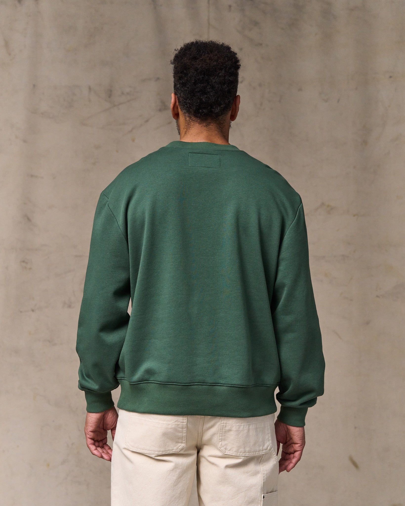 image of a model wearing Filson's Northwest Crewneck Sweatshirt - Granite Green