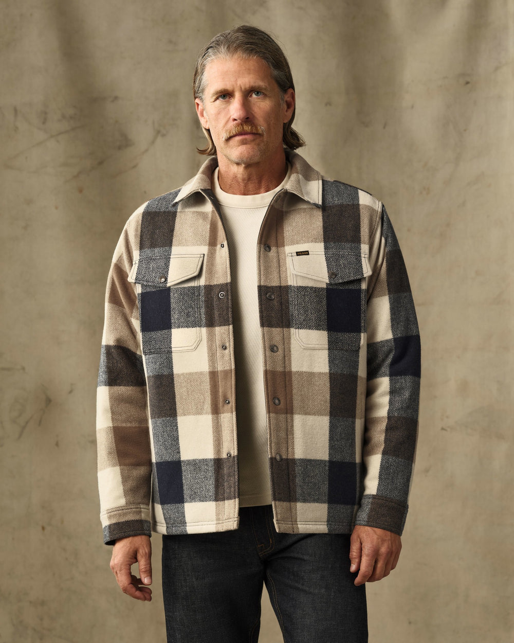 image of a model wearing Filson's Spokane Insulated Jac-Shirt - Cream / Navy Plaid