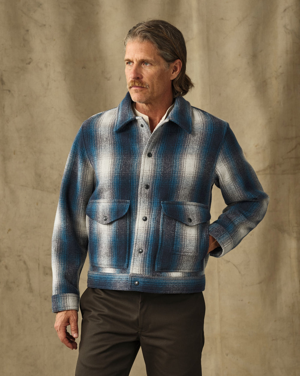 image of a model wearing Filson's Mackinaw Wool Work Jacket - Teal / Gray Ombre