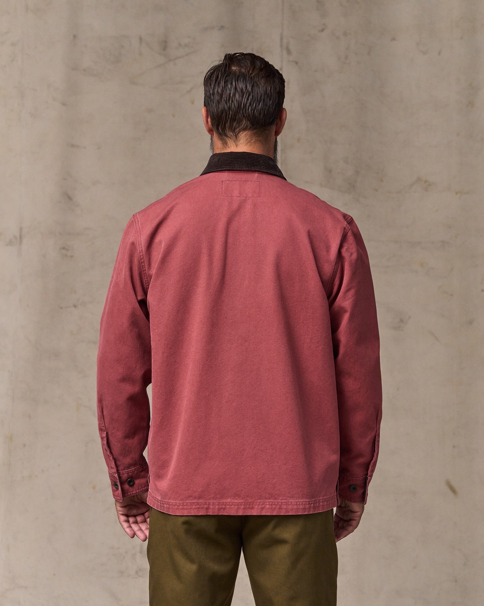 image of a model wearing Filson's Rustic Canvas Jac-shirt - Red Rock