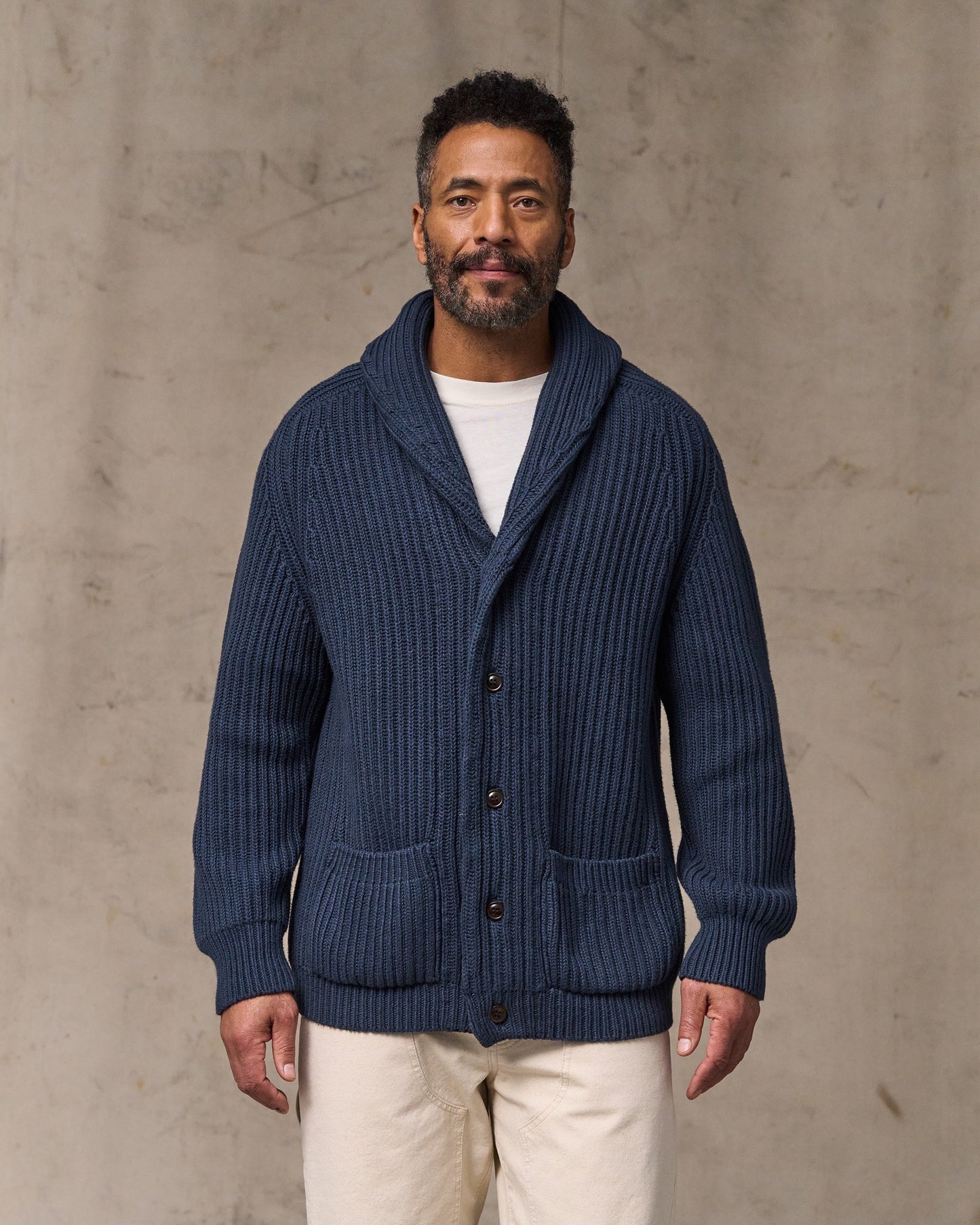 image of a model wearing Filson's Fisherman Rib Cotton Cardigan - Navy|Model is 6'2" wearing a size medium